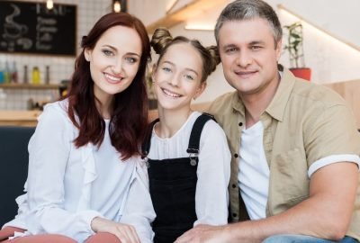 beautiful-smiling-family-embracing-in-cafe-2021-09-01-11-59-50-utc(1)